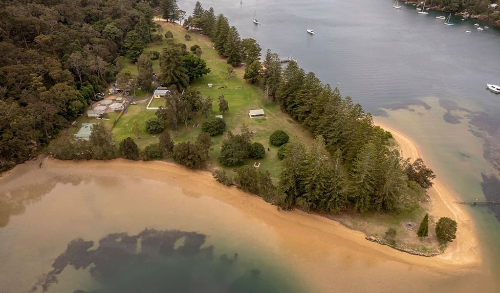 Tents beside Pittwater at The Basin Campground