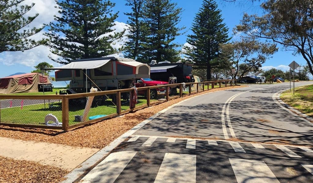 View of campsites and the access road at Trial Bay Gaol campground. Credit: Brandan Argent © DCCEEW