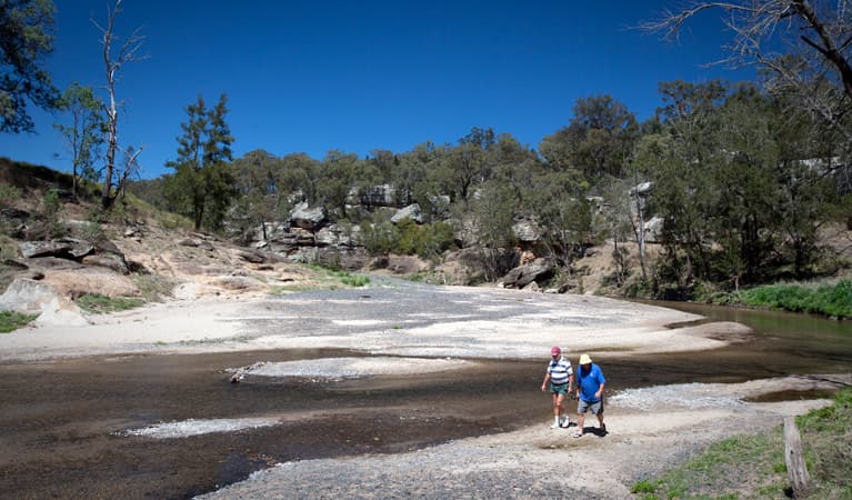 Two men walk along the Goulburn River at Big River campground, Goulburn River National Park. Photo: Nick Cubbin © DPIE