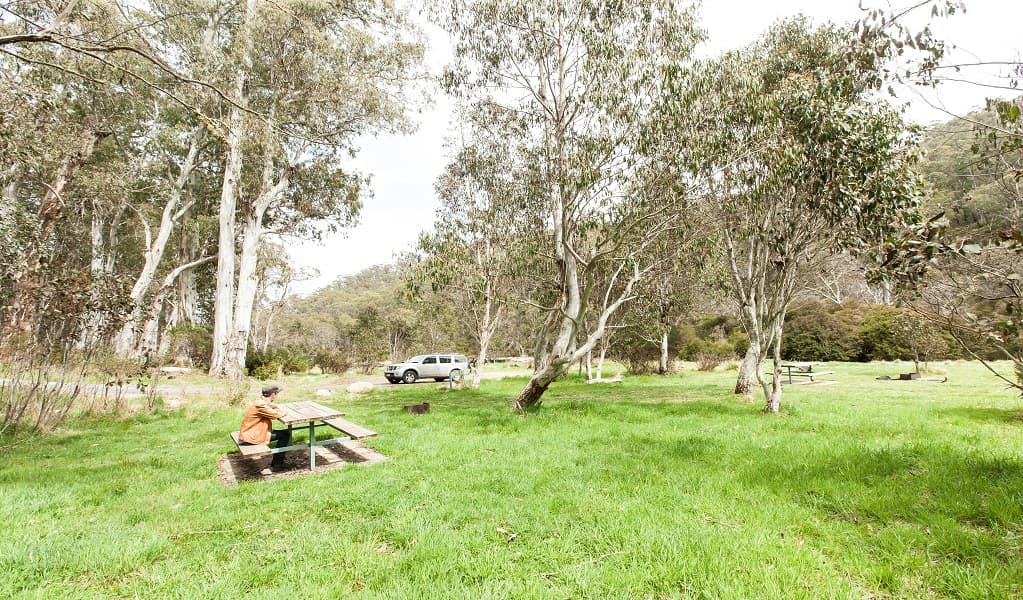 A visitor takes a break at Clover Flat rest area. Credit: Murray Vanderveer © OEH