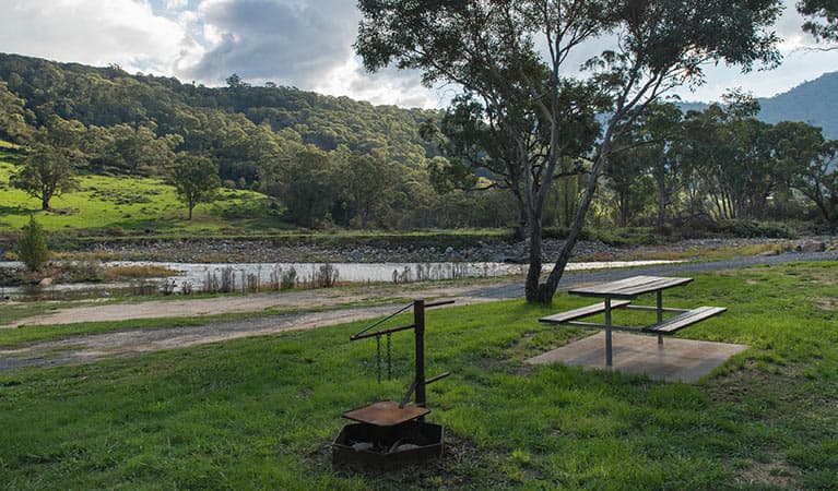 Fire ring and picnic table at Rock Flat campground, Kosciuszko National Park. Photo: John Spencer © DPIE