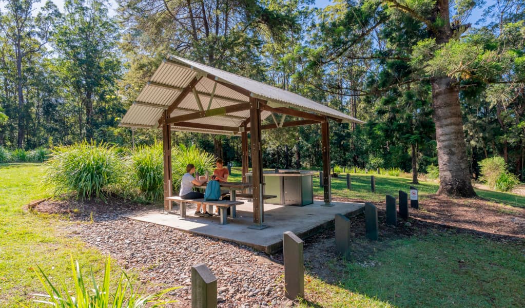 Campers sitting at the picnic shelter at Cutters Camp campground. Credit: John Spencer © DPE
