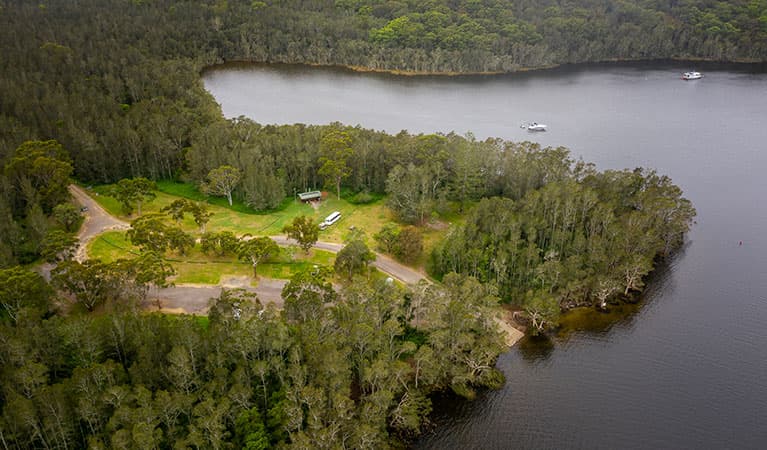 Aerial view of Violet Hill campground and picnic area with surrounding bushland and waterways in Myall Lakes National Park. Photo: John Spencer © DPE