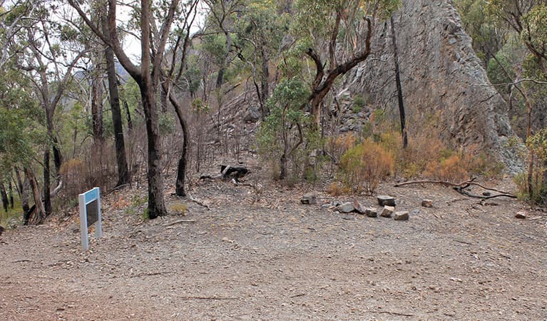 Camping area at Danu camp, set in rugged landscape of bushes, trees and rock formations. Photo: Blake McCarthy © DPIE