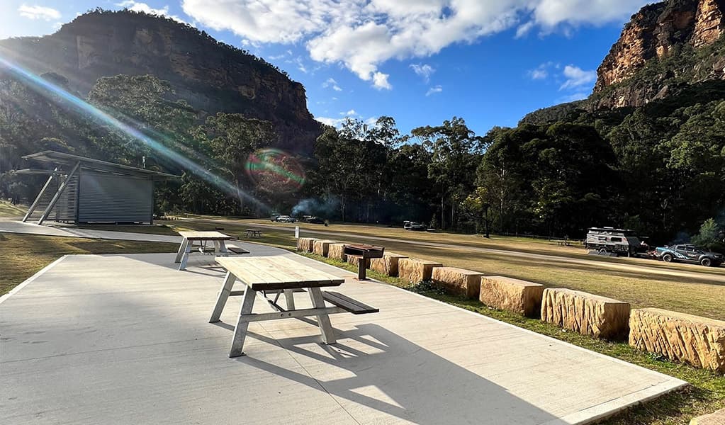 Picnic tables located on the wheelchair-accessible campsites. Credit: © DCCEEW